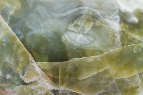Light green blurred background made of green jade or Nephrite Stock Photos