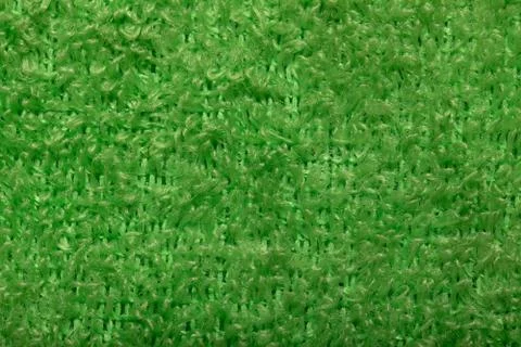 Light green fluffy background of thread. Terry fabric close-up. Stock Photos