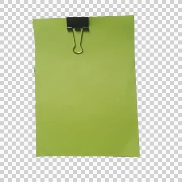 A light green paper sheet held by a black metal binder clip isolated on a t.. Фото