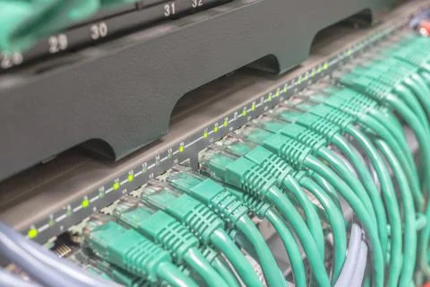 Light green patch cord internet cables connected Stock Photos