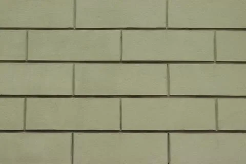 Light green plastered wall with rectangular pattern Stock Photos