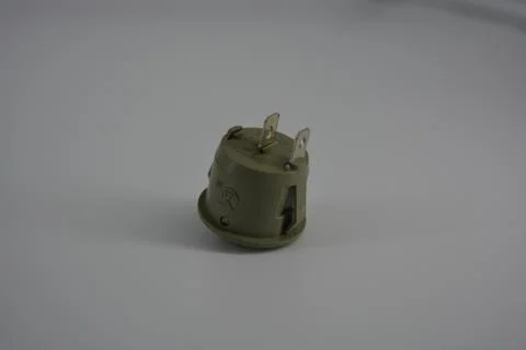 Light green plastic button for electronics, electrical engineering, electrics. Foto stock
