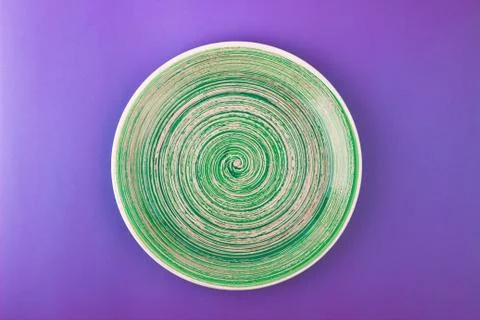 Light green plate on the violet background 写真素材