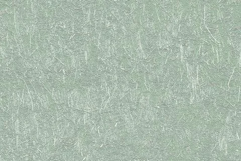 Light green textured background creating a vintage and rustic vibe Stock Photos
