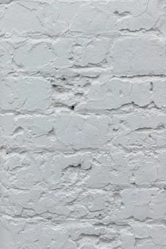 Light grey brick painted wall textured background close-up. Stock Photos