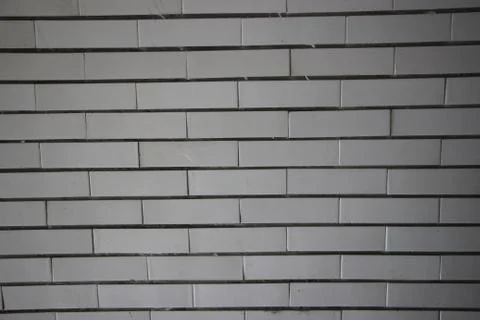 Light grey brick wall background surface pattern Stock Photos