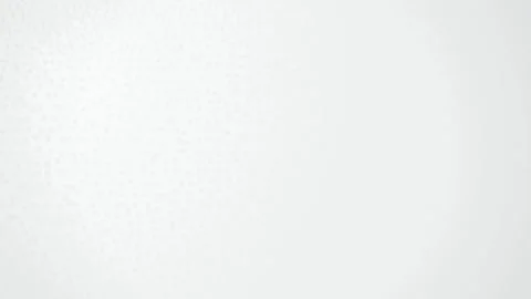 Light grey dots create a subtle wave pattern on a white background Stock Footage 340877384