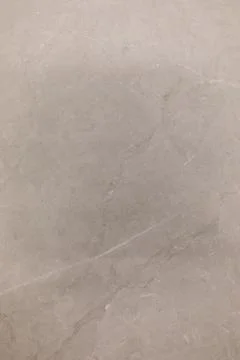 Light grey marble surface with subtle veining and texture patterns suitable for Stock Photos