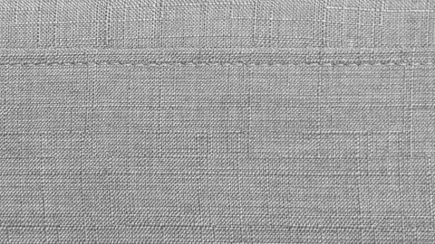 Light grey textile background with fiber detail and stitching Stock Photos