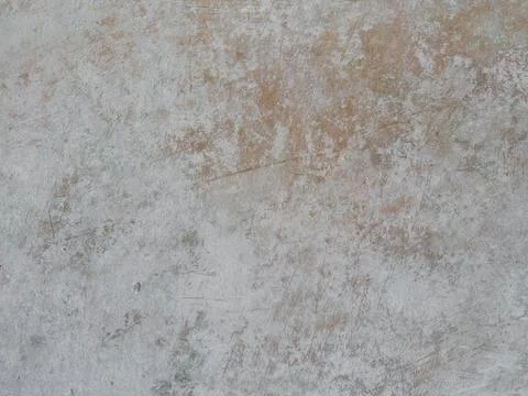 A light grey textured surface with subtle warm undertones and a concrete-li.. Stock Photos