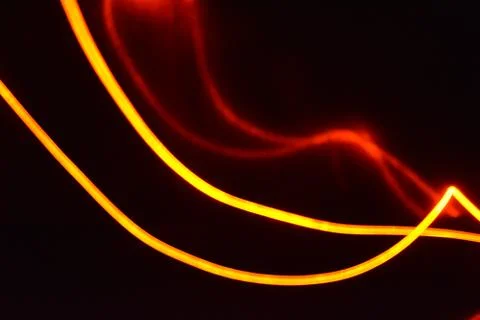 A light guide, wire with orange light guide wire with different light. Stock Photos