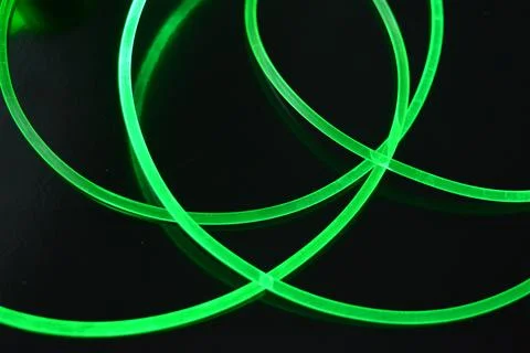 Light guides, illuminated thick wire, cable, tubes, rods of green, yellow. 스톡 사진