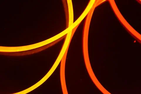 Light guides transparent wire, polyethylene tubes, rods of red, orange, yellow. 库存照片
