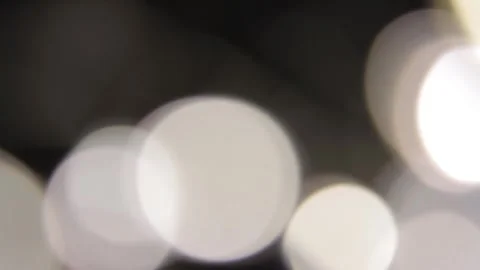 The light of the headlights from a very close view in the darkness, moving to th Vidéo 317482577