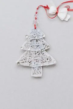 Light herringbone made of threads decorated with sequins and a bow. Top view Stock Photos