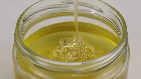 Light honey trickles Stock Footage 124605781