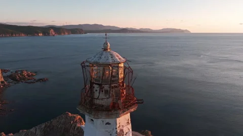 A Light House on Cliff Overlooking Ocean Stock Footage 266922927