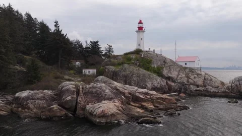 Light house on Rocky Shorline Stock Footage 333610545