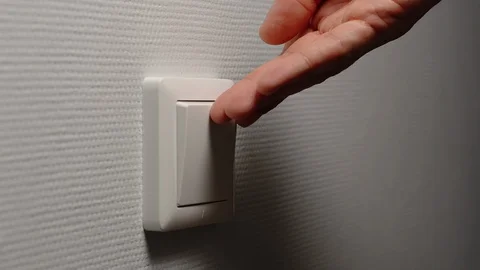 Light is Off - Human hand switch off a power button on a wall Video stock 124622773