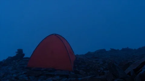 The light inside the tent. night, fog. overnight in the mountains. Elbrus in the Stock Footage 119264355