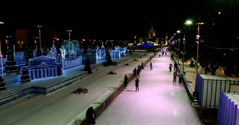 Light installations, top view, young people skating on the ice rink Stock Footage 67767874