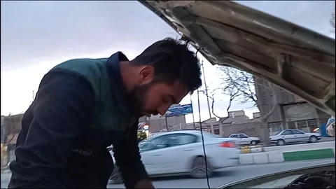 Light It Up - Electrician Swaps a Headlight Bulb Stock Footage 271151769