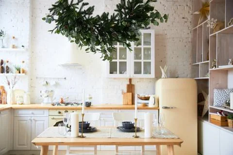 Light kitchen in the style of loft, preparation for the holiday, served table, a Stock Photos