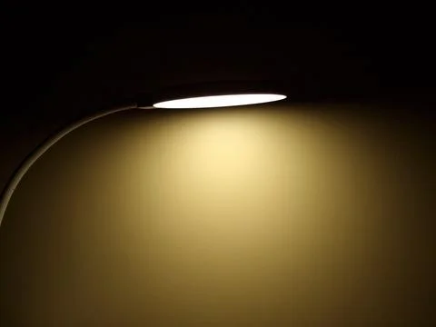 Light of a lamp in the darkness. Close up Stock Photos