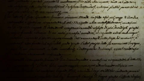 The light of a lamp illuminates an ancient manuscript of 1700 century Stockbeeldmateriaal 147605884