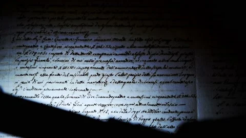 The light of a lamp illuminates an ancient manuscript of 1700 century 스톡 동영상 147605906