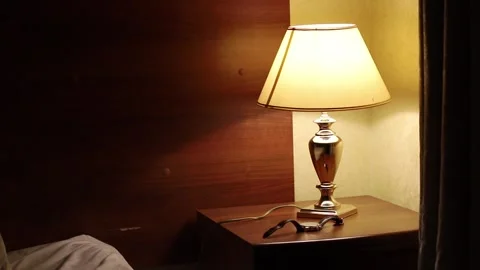 Light Lamp On Night Table In Hotel Room Video Stock Footage 312234324