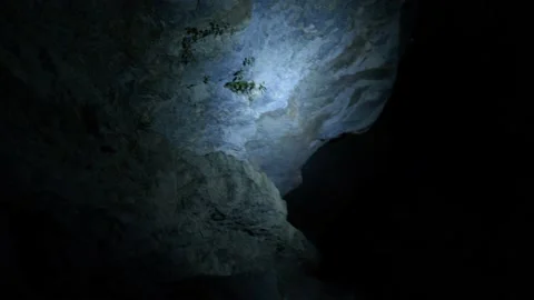 The light of a lamp is projected on a rock during a hike Stock Footage 210225698
