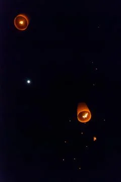 Light up lanterns flying to the sky at night Stock Photos