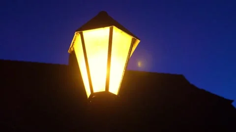 Light of lanterns at night.Flickering flashes light in the dark. Stock Footage 303400195