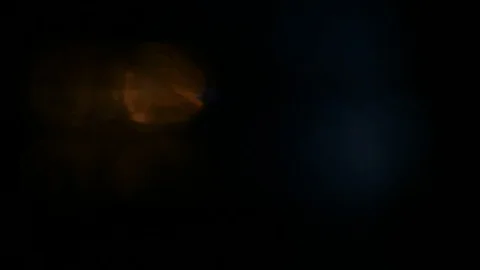 Light leak in 4K quality on dark background with.Real lens flare Video stock 81321279