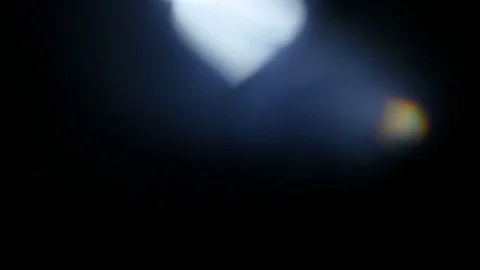 Light leak in 4K quality on dark background with.Real lens flare Stock Footage 81328587
