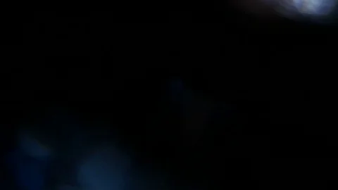 Light leak in 4K quality on dark background with.Real lens flare Stock Footage 81330121