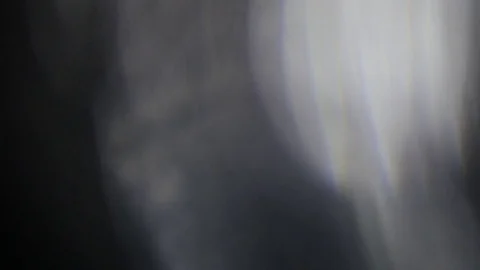 Light leak in 4K quality on dark background with.Real lens flare Stock Footage 81333881