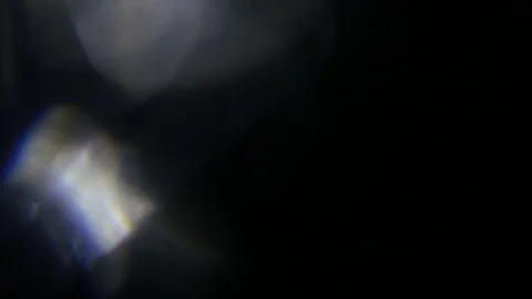 Light leak in 4K quality on dark background with.Real lens flare Stock Footage 81334397