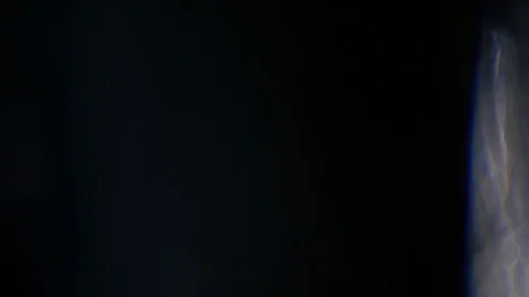 Light leak in 4K quality on dark background with.Real lens flare Stock Footage 81340517