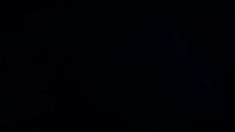 Light leak in 4K quality on dark background with.Real lens flare Stock Footage 81340957