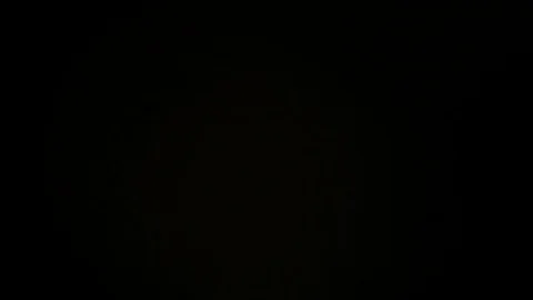 Light leak in 4K quality on dark background with.Real lens flare Stock Footage 81342336