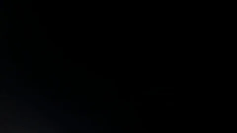 Light leak in 4K quality on dark background with.Real lens flare Video stock 81342597