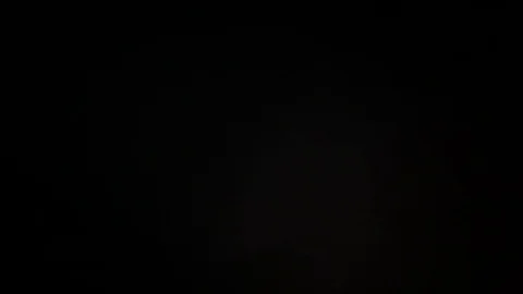 Light leak in 4K quality on dark background with.Real lens flare Stock Footage 81342877