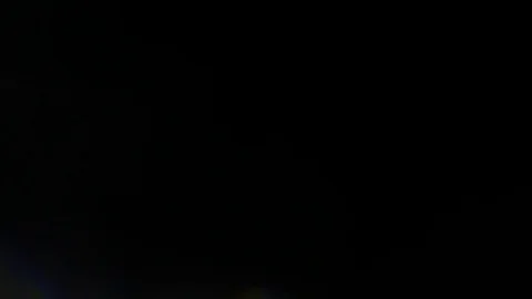 Light leak in 4K quality on dark background with.Real lens flare Stock Footage 81380009