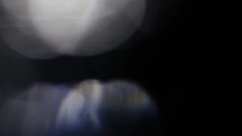 Light leak in 4K quality on dark background with.Real lens flare Stock Footage 81380811