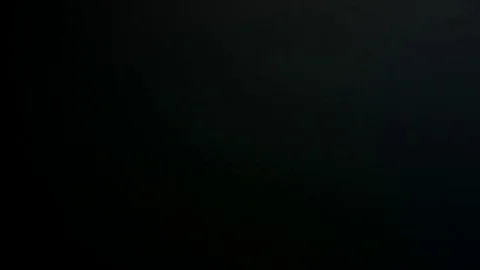 Light leak in 4K quality on dark background with.Real lens flare Stock Footage 81381052