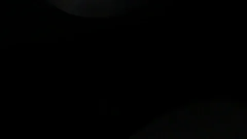 Light leak in 4K quality on dark background with.Real lens flare Stock Footage 81401783