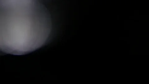 Light leak in 4K quality on dark background with.Real lens flare Stock-Footage 81401786
