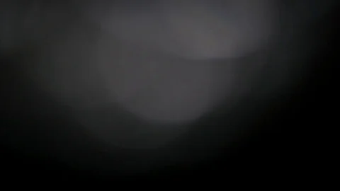 Light leak in 4K quality on dark background with.Real lens flare Stock Footage 81402277